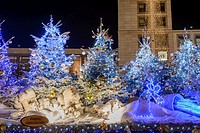 STUTTGART, GERMANY - DEC 11: a group of white bears between Christmas trees on stall roof at picturesque Christmas market hold in city center, shot at...