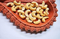 Dried fruits , Cashew nuts in earthenpot, Poona, mahrshtra,India.