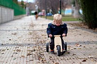 child on a tricycle.