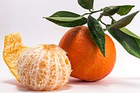 Tangerine and peeled tangerine on white background.