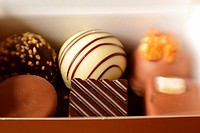 Box of praline-filled chocolates. Shot with LensBaby for selective focus.