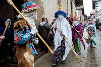 Participants in the Carnival of Lantz in Navarra broom through the streets giving people the assistant public.