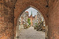 View through the Brama Mariacka Gate, through Ulica Mariacka to St. Marys Church (Bazylika Mariacka). St. Marys Church Gdansk is one of the largest br...