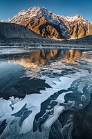 Mt Wakefield , ice bubbles and winter reflection in Mueller Lake, Aoraki / Mount Cook National Park, Canterbury, New Zealand.