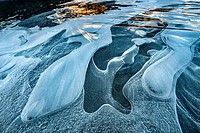 Ice bubbles and dawn light, edge of frozen Mueller Lake, Aoraki / Mount Cook National Park, Canterbury, New Zealand.
