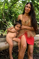 Yagua tribe located near Iquitos, Amazonian, Peru. A riverside woman poses with her daughter. .