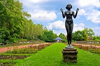 Female nude bronze statue from 1936 by German sculptor Felix Pfeiffer, entitled RECOVERY and set up in the Rose Garden of Dresden, Saxony, Germany.
