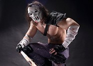 Costumed hero as a street maniac with a bat. Casey Jones on black background.