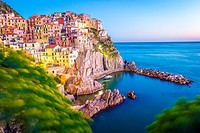 Manarola, Cinque Terre, Liguria, Italy. Sunset over the town, view from a vantage point.