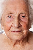 frontal view of the face of an elderly woman.
