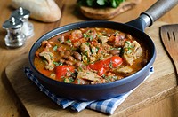 Smoky chicken and bean stew in a pan.