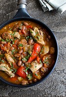 Smoky chicken and bean stew in a pan.