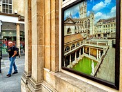 Photo advertising the Roman Bath on a wall . Bath. Somerset. England. United Kingdom.