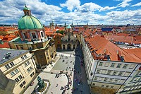 St Francis of Assisi Church and rooftops of the Prague city skyline in the Czech Republic.