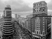 Black and white view of the street Gran Via de Madrid at the height of the Plaza de Callao