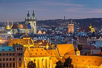 Night falls in Prague old town, Czech Republic. . The medieval church of Our Lady before Tyn dominates the city skyline.