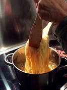 spaghetti cooking in a pot