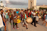 A group of musicians moving through Antonio Maceo Park in Central Havana, Cuba.
