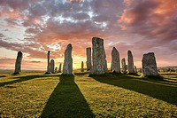 Calanais Standing Stones central stone circle, at sunset, erected between 2900-2600BC measuring 11 metres wide. At the centre of the ring stands a hug...