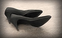 Vintage black shoes. Still life of a pair of old and elegant ladies shoes with high heel.
