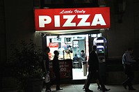 Pizza shop at night in New York City
