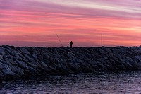 Fishing in a quiet evening. Port Balis, Sant Andreu de Llavaneres, Maresme, Barcelona province, Spain