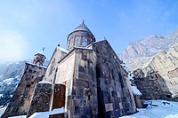 Gate to yard of Geghard monastery in Armenia in Winter.