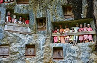 Galleries of tau-tau guard the graves. Lemo is cliffs old burial site in Tana Toraja, Sulawesi, Indonesia.