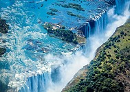 Aerial shot looking over Victoria Falls, the natural border of countries Zambia and Zimbabwe, Africa.