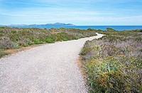 Gravel road towards the sea in north Mallorca, Balearic islands, Spain.