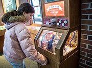 A preteen is buying a souvenir penny at an old Fort. Fort Macon State Park, originally called, Fort Dobbs then Fort Macon Military Reservation, is on ...