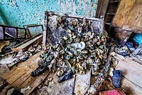 Old gas masks in abandoned Jupiter Factory in Pripyat ghost town of Chernobyl Nuclear Power Plant Zone of Alienation in Ukraine.