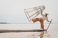 A fisherman poses for a photo. Inle Lake, Myanmar.