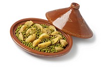 Traditional Moroccan oval tagine with meat, peas and fennel on white background.