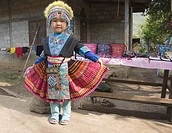 A young girl in traditional Hmong dress in Laos near the Mekong River. 3/16.