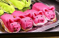 Marizpan pastry pigs in a shop window in Narbonne, France.