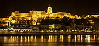 Budapest Castle by night in on Danube river.