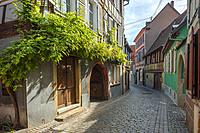 lane with old colourful houses in the village Barr, on the Wine Route of Alsace, France.