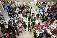 Hordes of shoppers throng the Macy's Herald Square flagship store in New York looking for bargains on the day after Thanksgiving, Black Friday, Novemb...