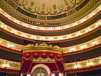 Interior of the Alexandrinsky Theatre in St. Petersburg, Russia. Shown are the balcony levels and part of the building´s domed ceiling.