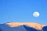 Moon on a summit of the snowy Huaytapallana, achieved using a double exposure from the camera. Huancayo, Perú