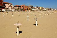 A row of small Poles at Sandy Beach, scenic View at the Beach, Viserbella Beach, Buildings, Hotels of Viserbella, Emilia Romagna, Provence of Rimini, ...