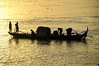 Fishermen at sunrise,Tonlé Sap river,Phnom Penh,Cambodia,South East Asia,Asia.