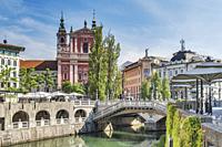 View over the river Ljubljanica to the promenade and the Franciscan church. The church was built between 1646 and 1660. It is located on the Preseren ...