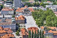 View over the old town of Ljubljana to the square Kongresni trg (Congress Square). At the Congress Square are the buildings of the Trinity Church, the...