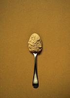 Spoon of silver with cocoa.