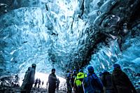 Ice cave tour in Breidamerkurjökull glacier, which is an outlet glacier of the larger glacier of Vatnajökull (region of Austurland, Iceland).