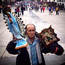 A pilgrim holds images of the Virgin of Guadalupe and Saint Jude Thaddeus during the annual pilgrimage to the Our Lady of Guadalupe basilica in Mexico...