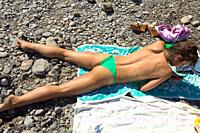 Beautiful sexy topless woman on the beach, Yalta, Crimea, Ukraine.