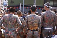 Participants showing their full body tattooed, possibly members of the Japanese mafia or Yakuza, attend the Sanja Matsuri in Asakusa district on May 2...